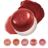 a close up of a ball of makeup on a white background