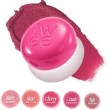 a close up of a ball of makeup on a white background