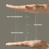 Two hands gently holding strands of the Jumiso Snail Mucin 95% + Peptide Essence, demonstrating its hydrating and non-comedogenic qualities!