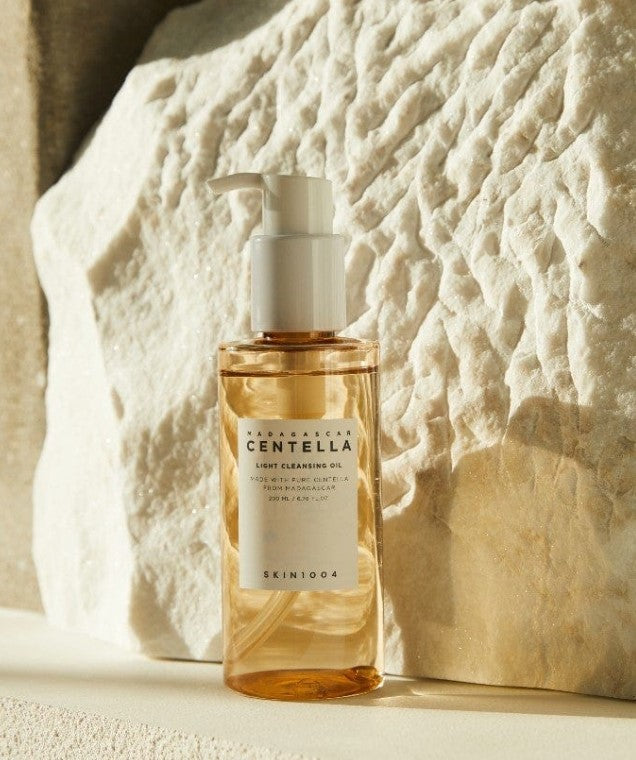 Display of Skin1004 Madagascar Centella Light Cleansing Oil with bold product title, emphasizing its award-winning formula for deep cleansing.