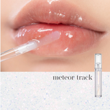 Lips glistening with rom&nd Glasting Water Gloss in Meteor Track, highlighting the glossy finish and shimmering particles.